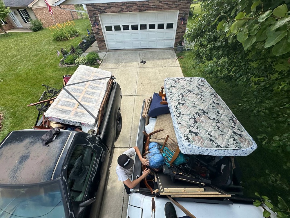 Two trucks loaded on a West Chester basement cleanout