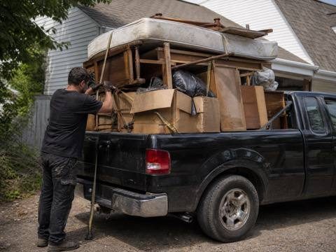 Pickup truck loaded with furniture and boxes on a West Chester haul